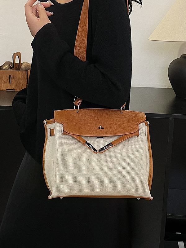 Bolsa de mano transfronteriza para mujeres 2026 nueva tela de lino empalmada color de textura de viaje mochila de hombro