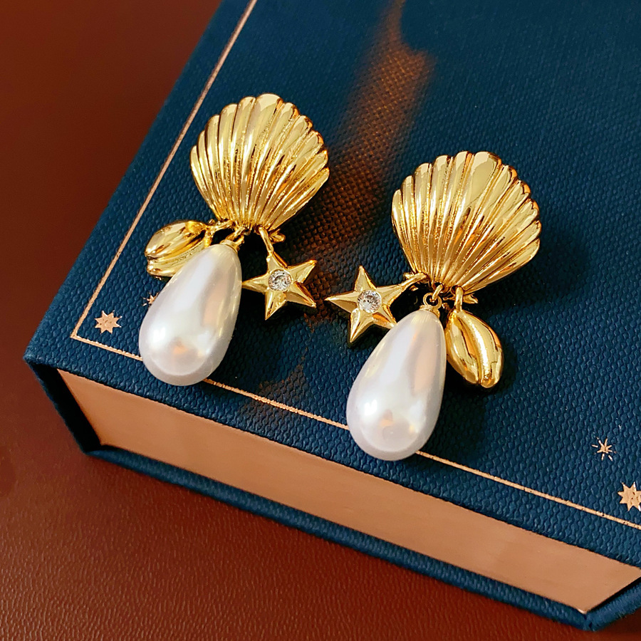 Aguja de plata MEDIADOS DE-antigua flor redonda borla pendientes de metal retro europeo y americano elegante luz pendientes de lujo al por mayor para las mujeres