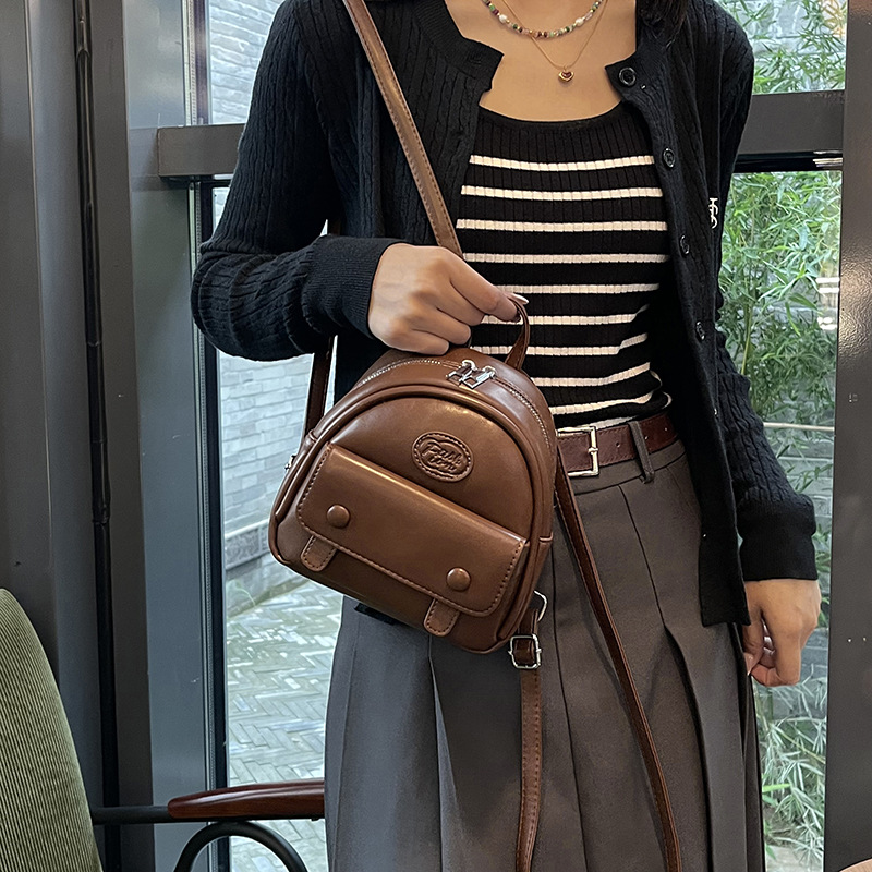 2025 mochila coreana de mujer simple color sólido mini mochila nueva bolsa de viaje ligera para mujeres