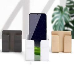 Place mobile phone charging base bracket wall-mounted remote control rack multi-functional punch-free wall storage rack wholesale