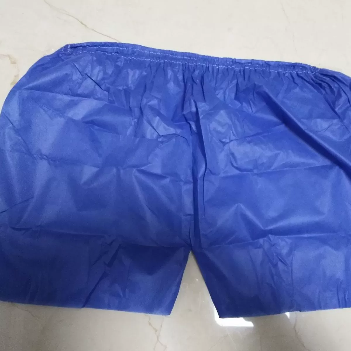 Одноразовые нетканые синие боксеры производители оптом брюки для сауны Отель поставляет штаны для ног ручной работы