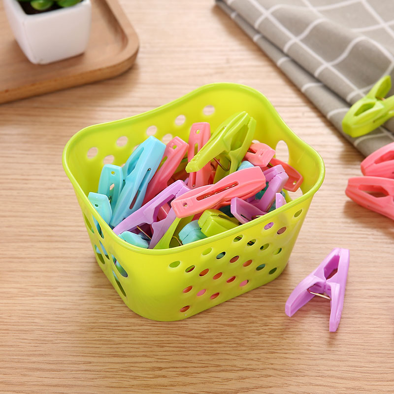 Venta al por mayor de fuertes clips a prueba de viento, calcetines de secado, edredones de ropa, tendedero de plástico para el hogar, canasta de almacenamiento de color caramelo, clip pequeño