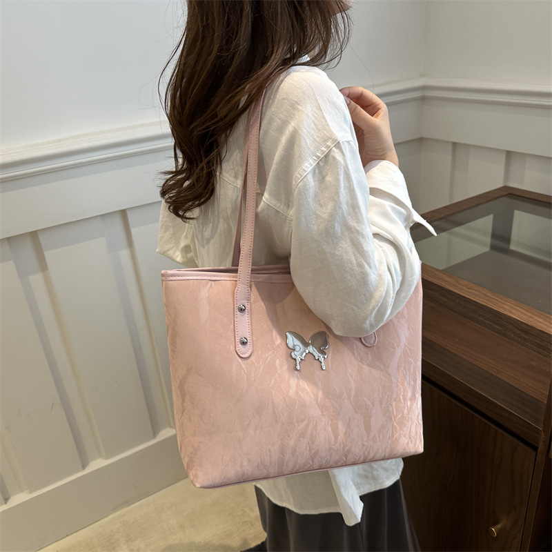 Alta sensación de plata tote2024 nuevo estudiante de gran capacidad arco brazo bolso de brazo versátil bolso de viaje