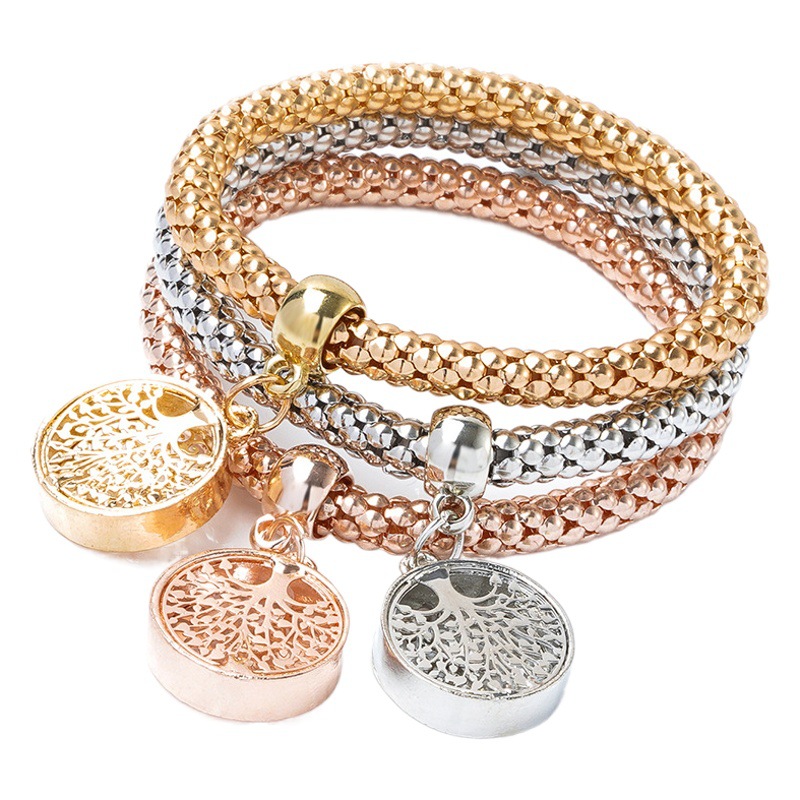 Europea y americana transfronteriza Venta caliente aleación tricolor traje estiramiento palomitas de maíz cadena de oro y plata anillo de diamantes de cobre pulsera femenina