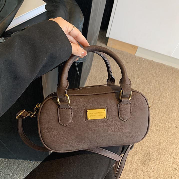 Bolso de bolos de mano de moda 2024 nuevo bolso de mujer retro simple bolso de hombro de alta calidad bolso de mochila universal mujer
