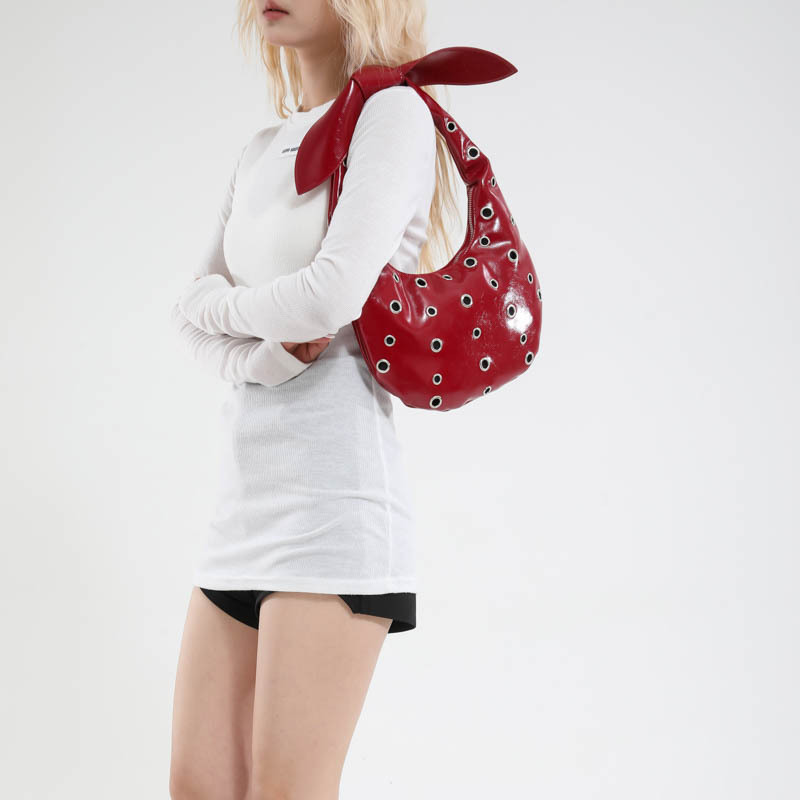 Bolso de axila con textura transfronteriza 2025 verano nuevo bolso femenino cielo estrellado agujero agujero bolso de hombro con remache hueco