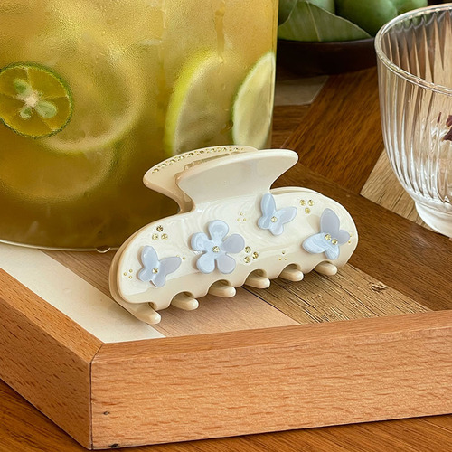 Korean blogger-style delicate, fresh, and three-dimensional hair clips: butterfly and flower designs with full rhinestone accents—perfect for the back of the head, featuring a sleek shark clip design.