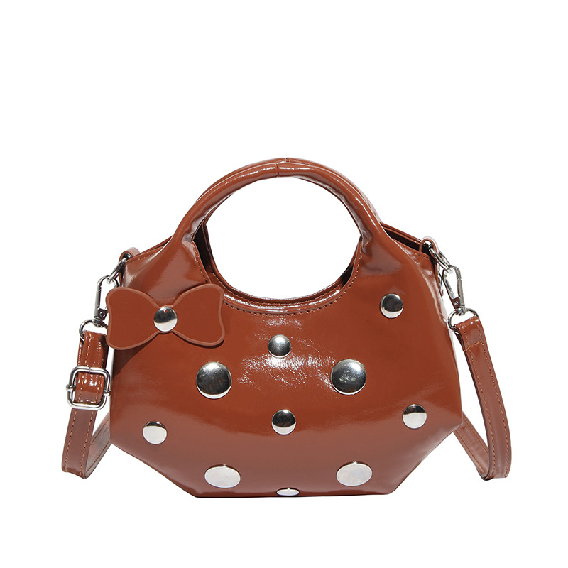 Bolso de alta calidad con textura 2025 verano nuevo bolso femenino moda bowknot bandolera personalidad remache bandolera