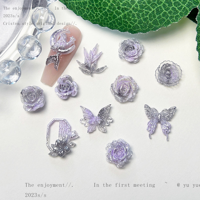Nueva joyería de uñas de estilo gris-púrpura salvaje de estilo ins mezclada luminosa tridimensional de flores pequeñas accesorios de armadura al por mayor