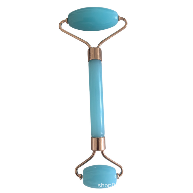 Rodillo facial de cristal en forma de corazón para masaje y lifting