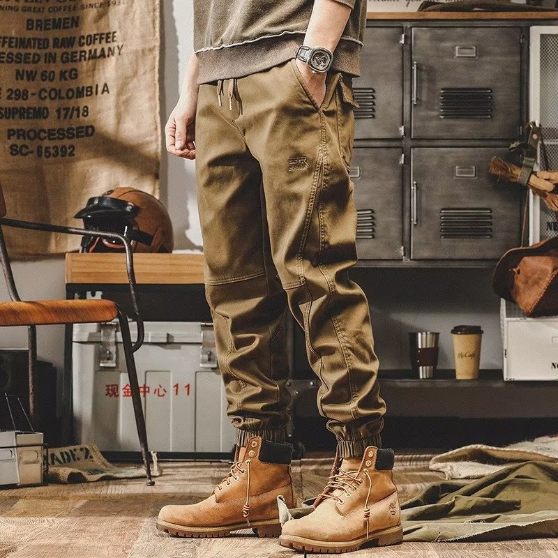 Pantalones casuales para hombres Primavera y otoño Nueva marca de moda coreana suelta más pantalones atados al tobillo pantalones al aire libre con volantes pantalones harén guapos en stock al por mayor
