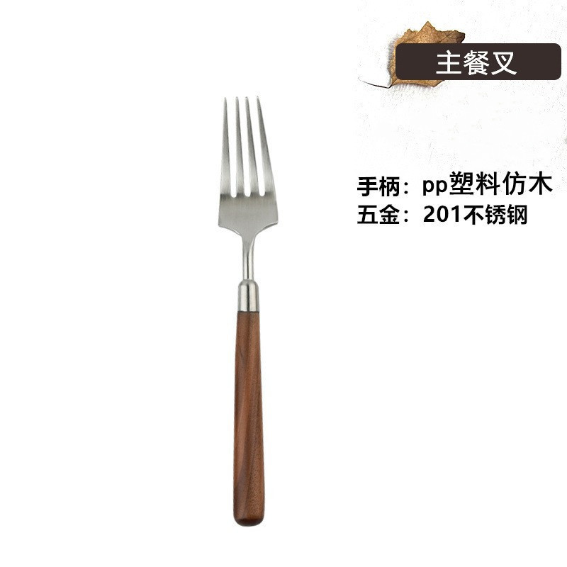 ステンレスの木の柄の食器の洋食ナイフの高級感は胡桃の木のスプーンをまねてスープを飲んでステーキのフォークのセットを食べます。|undefined