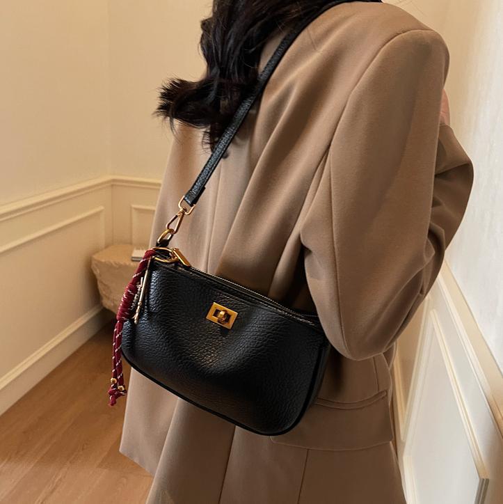 Bolso de explosión de comercio exterior para mujeres 2025 nuevo estilo universal retro de alta sensación bolso de hombro de moda universal bolso de hombro