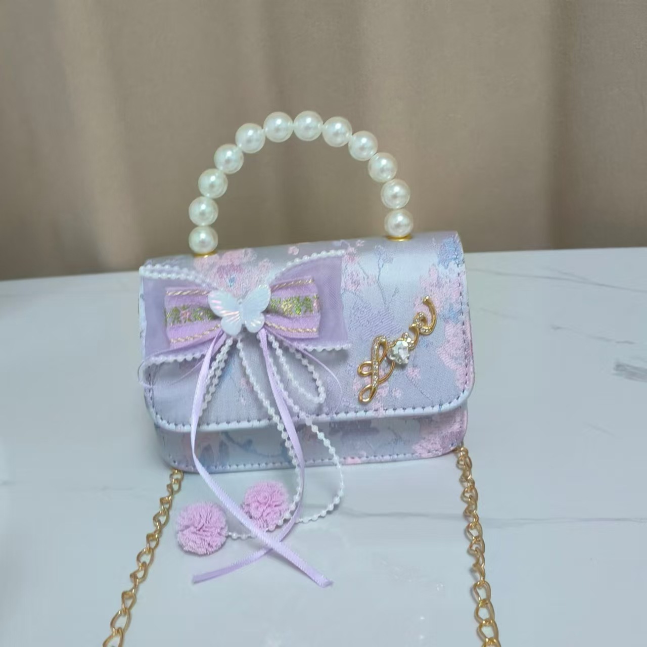 Bolsos infantiles de alto nivel antiguo bolso de cambio de niña pequeña princesa de perlas accesorios de ropa Han bolso de almacenamiento