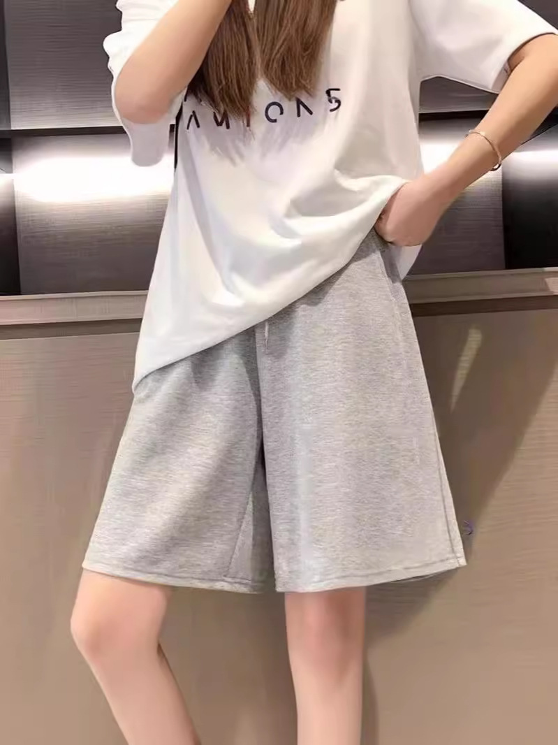 Compre uno gratis 15 pantalones cortos de color sólido deportivos para hombres y mujeres super delgados en forma de A versátil pareja de pantalones de verano