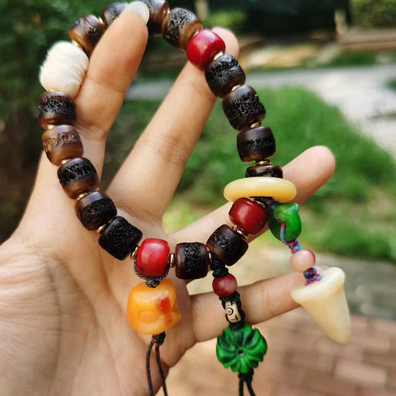 牦牛头盖骨手串手持老料嘎巴版盘龙狮子双牙民族风藏式手持批发