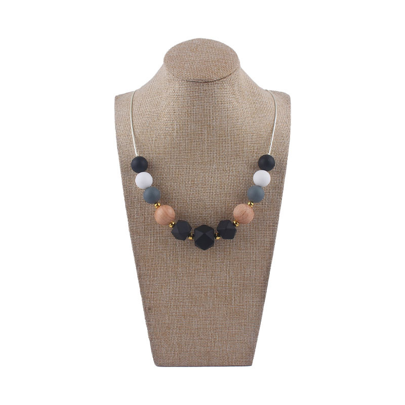 Los nuevos bebés de contraste de color de silicona octogonal mordedor collar de los bebés mordedor palo masticable colgante collar