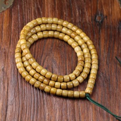 チベットの天然牛の骨の多い輪の手の串は古いヤクの骨の桶の玉を作ってまっすぐに仏の玉を切って糊の骨を包んで直播します。