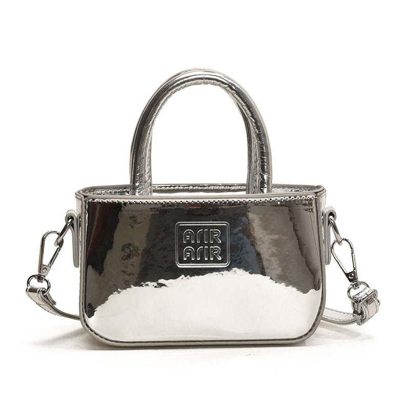 Bolsa de hombro coreana para niñas de color sólido, bolso láser de moda, mini bolso para bebés, 2025 nuevo bolso para niños
