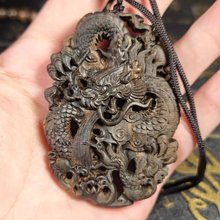 印尼达拉干双面镂空雕刻工艺车挂手把件原木龙牌7公分乌木