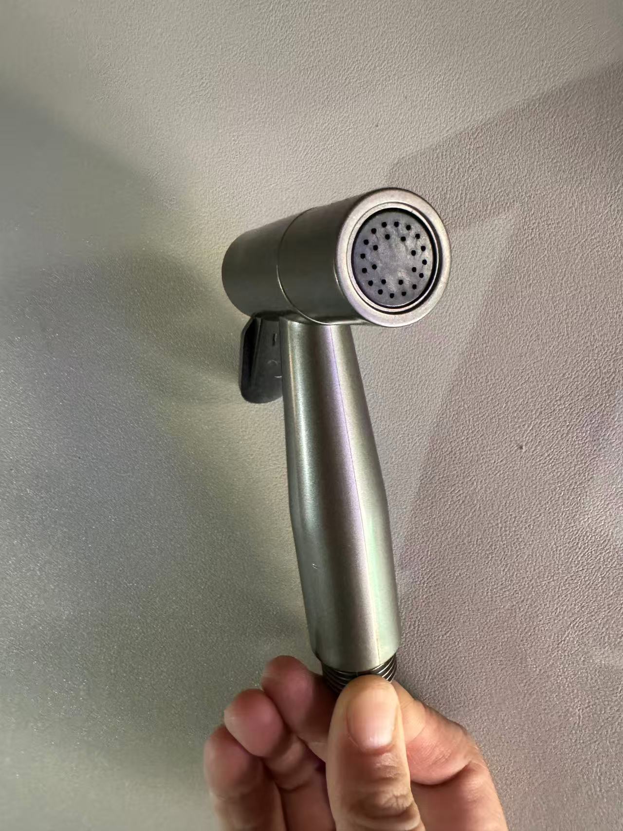 Grey high-pressure spray gun companion, bathroom flushing, handheld nozzle, toilet, feminine wash, small showerhead undefined