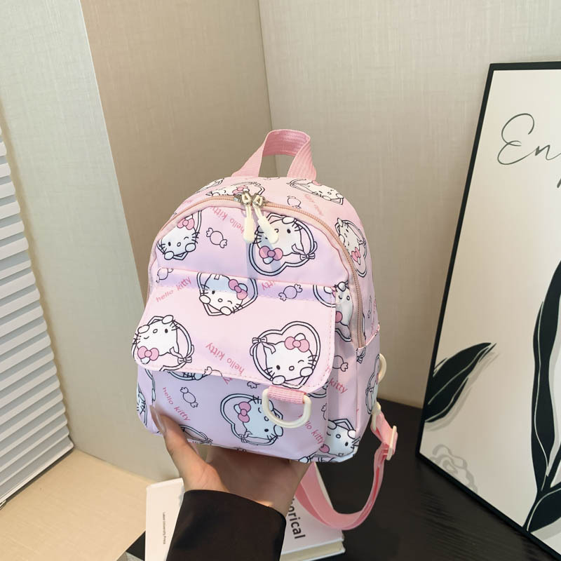 Mochila nueva al por mayor 2025, mochila de tela Oxford con diseño de dinosaurio de dibujos animados, mochila pequeña de gran capacidad para actividades al aire libre y ocio.