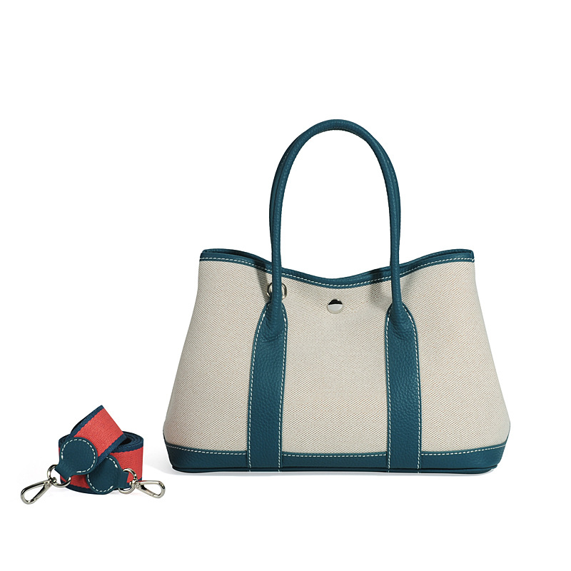 大容量ガーデンバッグキャンバスは色にぶつかった本革のトップ層牛革をつなぎ合わせて、シングル肩のショッピングバッグを持っています。