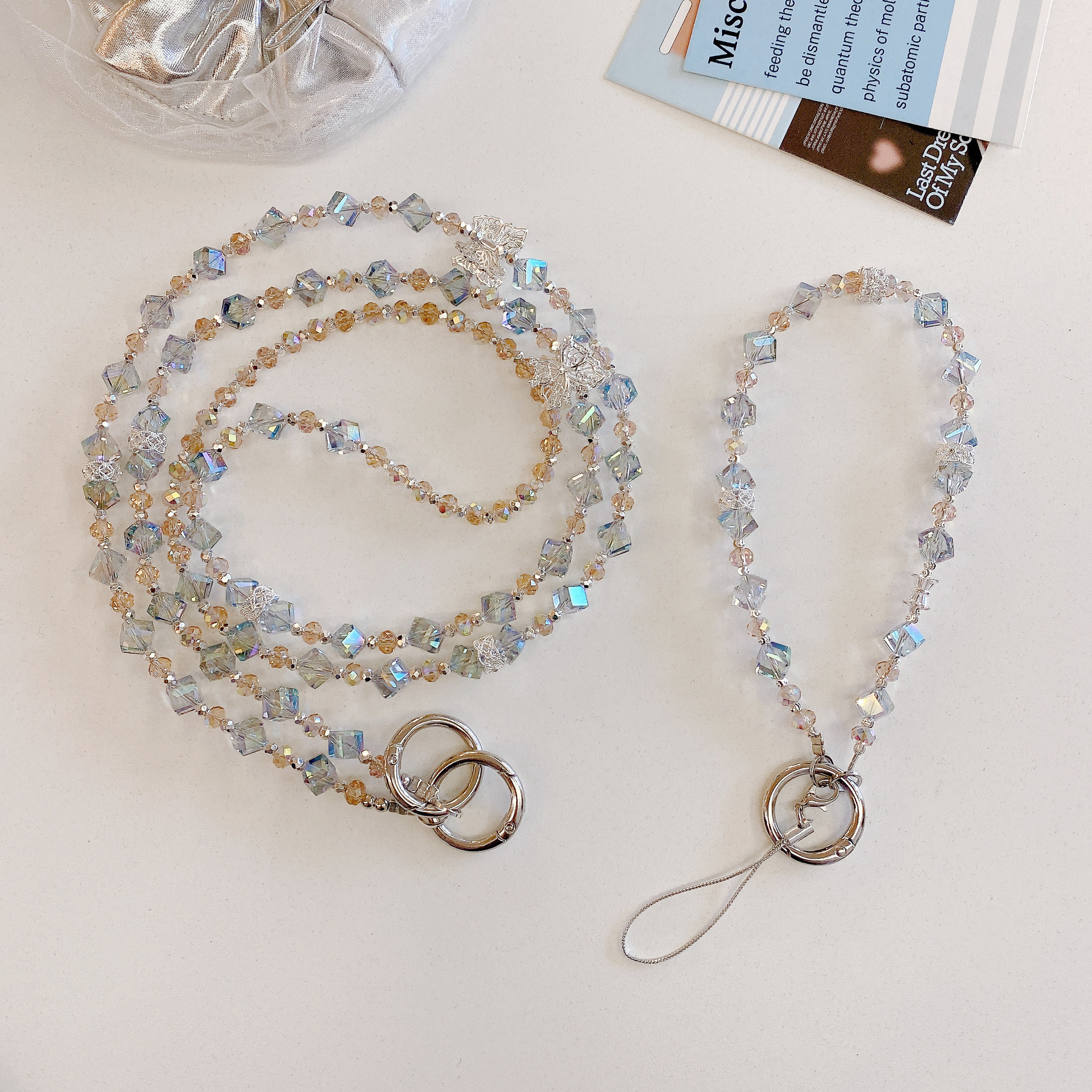 Boutique hecho a mano de alta gama para teléfono móvil cadena larga oblicua de viento ins cordón de teléfono móvil de moda colgante de mensajero largo