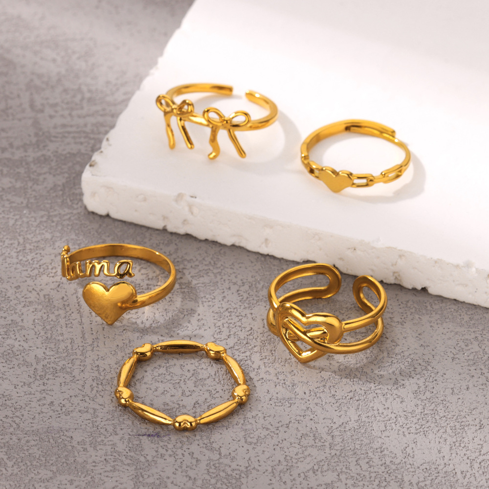 Anelli delicati impilabili bicolore, set di stratificazione in metallo misto di tendenza, fasce sottili minimaliste in oro e argento, simboli di stelle iniziali incisi, impilabili da 3 a 5 pezzi, moda_voghion.com