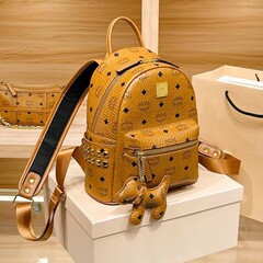 オリジナル mc バックパック男性と女性のためのクラシックミニ小中サイズ左右リベット小さなバックパックシングルショルダークロスボディバッグ