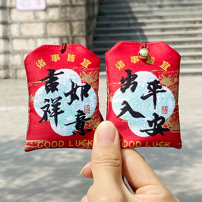 Red protective amulet, small bell