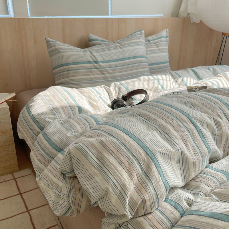 Una clase de algodón cuatro piezas de tejido de agua lavado sábanas de algodón cubierta dormitorio de estudiantes cama de tres piezas de impresión y teñido activo