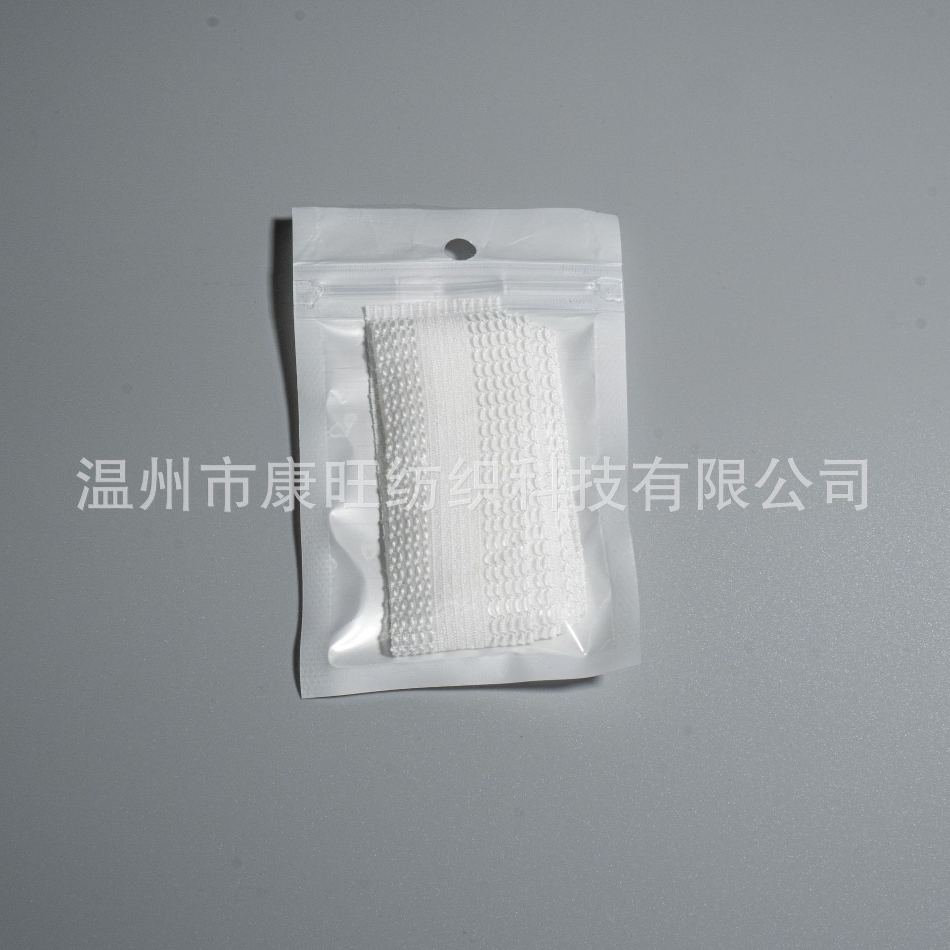 Los pantalones de la fábrica de Wenzhou se pegan en la boca del pantalón se acortan