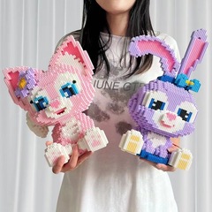 潮楽森は小さい粒子のおもちゃの星の黛露のウサギの積み木の男の子の女の子を詰めて屋台を並べて卸売りします。