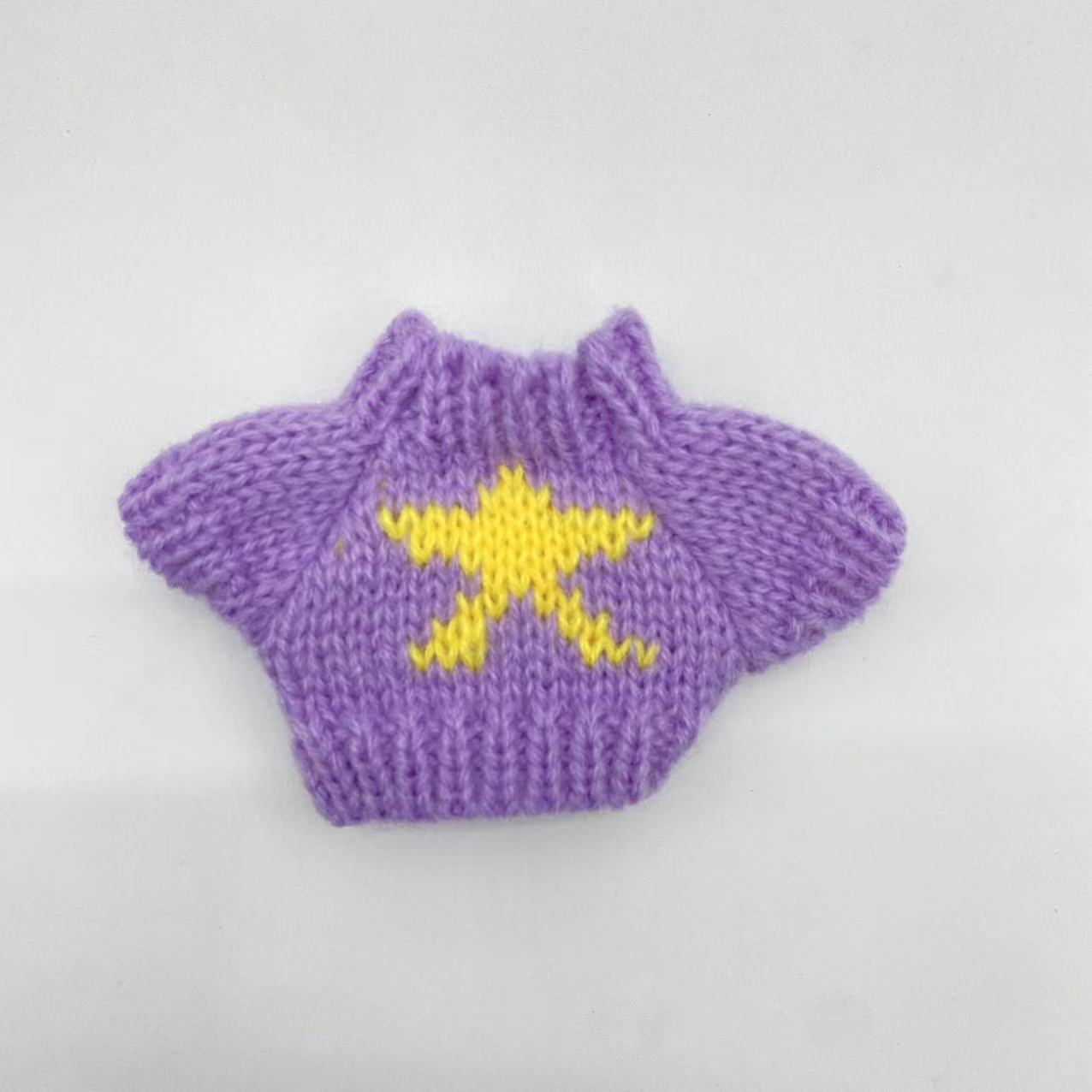 Yellow starfish on purple background