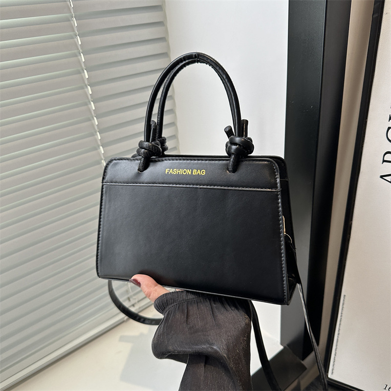 Bolso de mano damas 2025 nueva primavera y verano textura superior nicho de gran capacidad retro bolso de mano tote