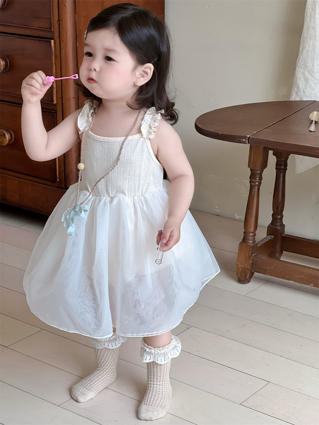 Vestido de malla para niñas, estilo fino de verano, ropa para niños coreanos, falda de trasero con correa de bebé, falda de princesa nueva 2025
