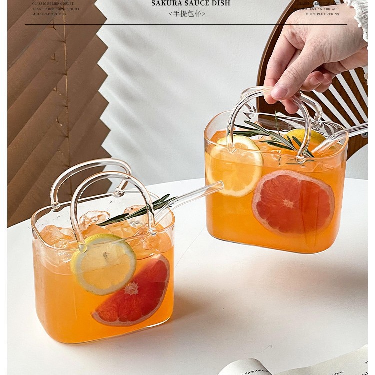 Bolsa de mano de vidrio transfronteriza, taza de té de fruta roja en línea, creativa transparente, extraña, taza de jugo de frutas de alto valor.