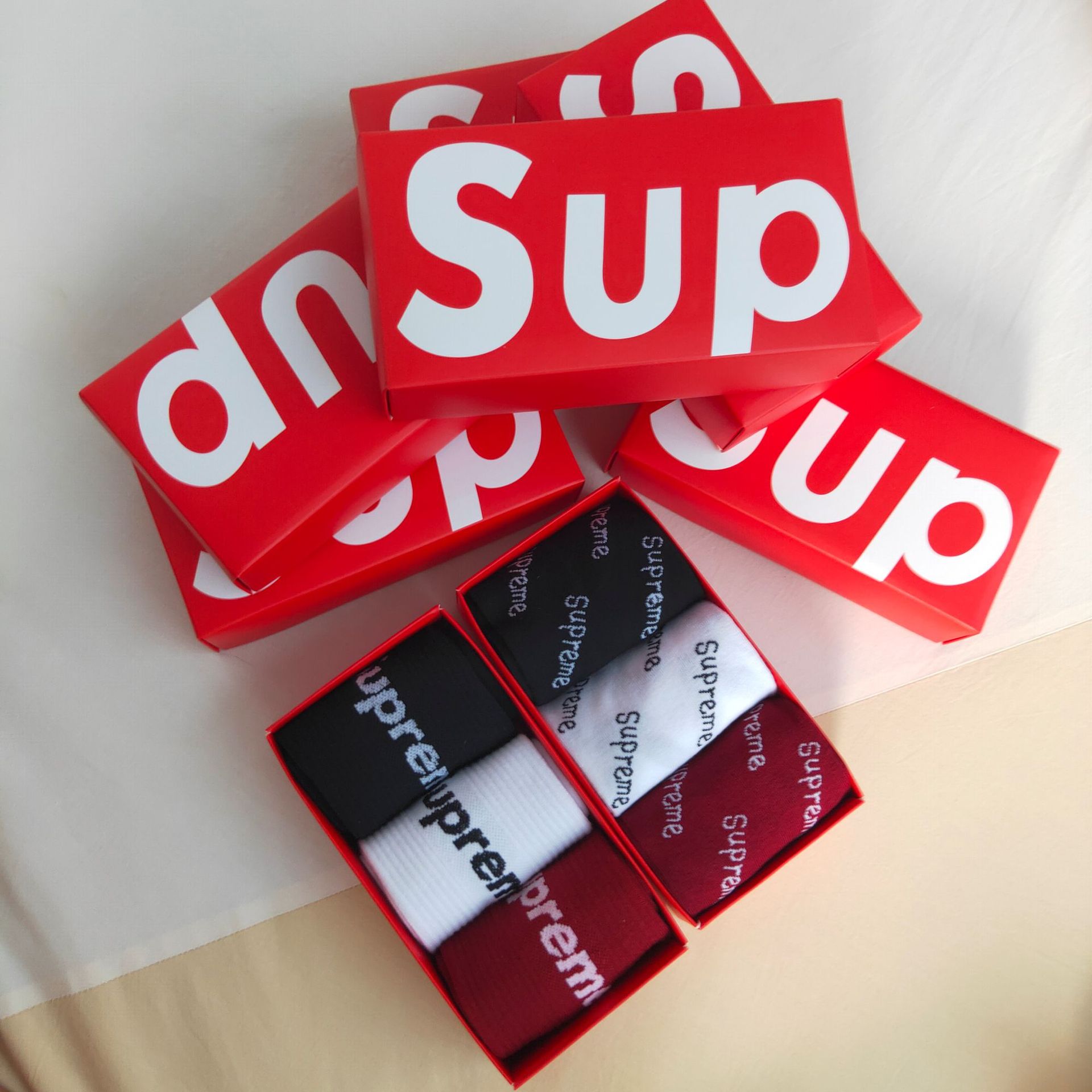 Boxed Supreme socks for men and women wi...