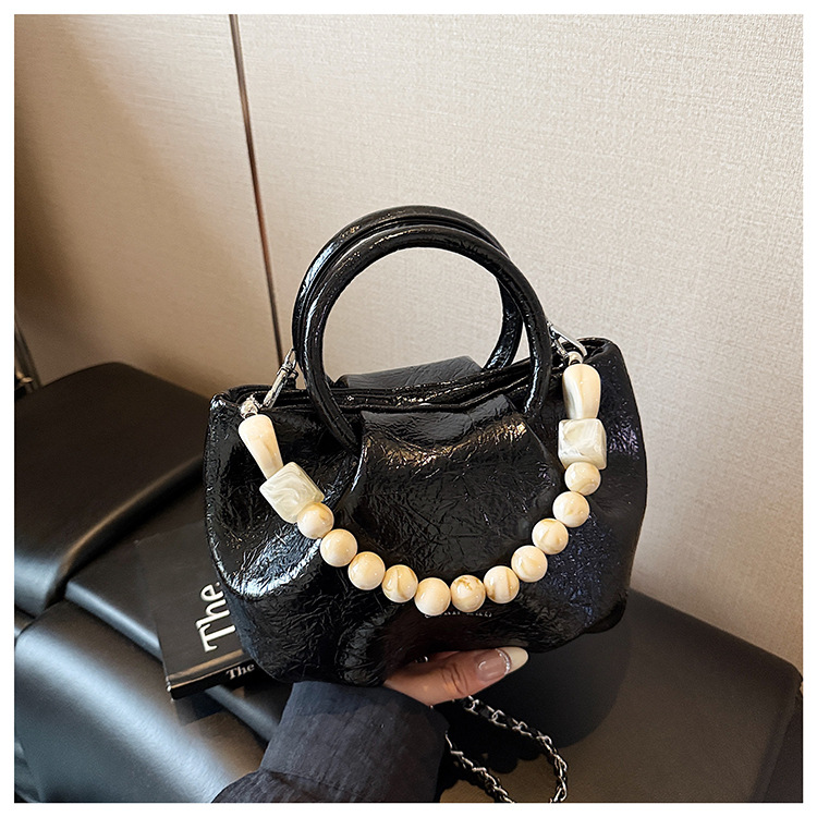 A stylish and trendy beaded bag for women, a new summer chain crossbody cloud bag for women in 2025 undefined