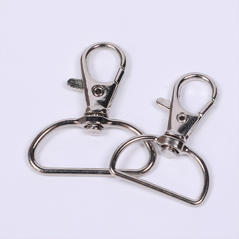 Suministro de metal en stock D-tail Boquilla de pescado de aleación de aluminio DiDi Joyas de proceso llavero gancho giratorio
