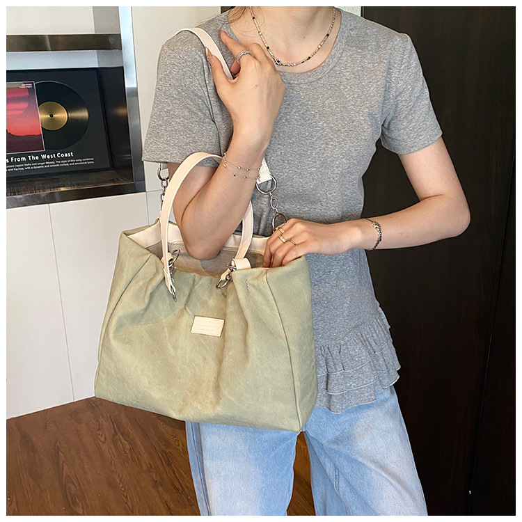 Korean style simple and versatile bag for women, new summer 2025 fashion and niche handbag, large capacity tote bag for commuting undefined