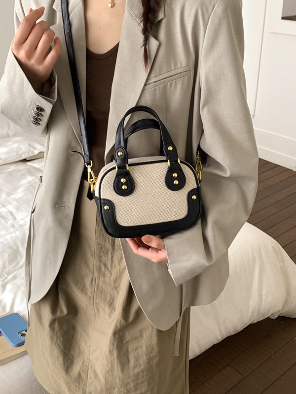 Hot sale nuevo lienzo empalme color contraste bolos portátiles de textura alta pequeña parte coreana nicho mochila de hombro
