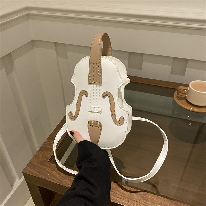 Europa y Estados Unidos personalidad órgano guitarra mochila de invierno para mujeres 2024 nuevo estilo extranjero bolso de hombro creativo de moda violín