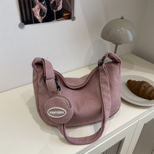 灯芯绒包包女大容量2025新款春夏休闲单肩斜挎布包上课通勤饺子包