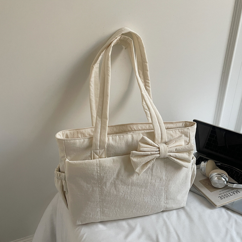 Bolso de lazo retro simple y ligero de color sólido bolso especial de costura de coche de moda femenino bolso de ropa de algodón de textura de hombro único bolso de moda