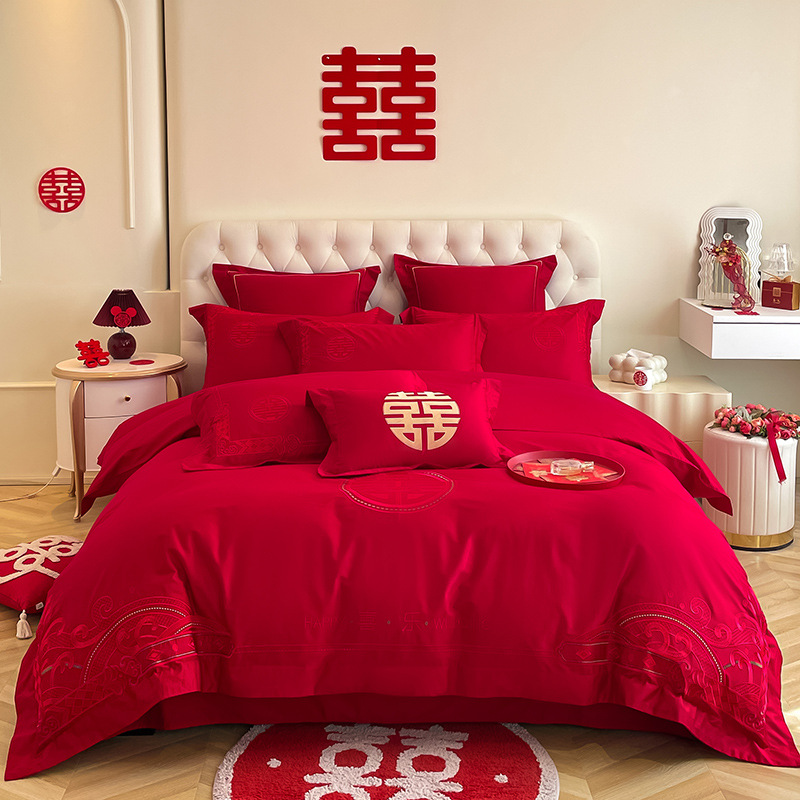 Una clase de madres y bebés de algodón de boda cuatro piezas grandes sábanas bordadas rojas chinas cubierta de cama de boda