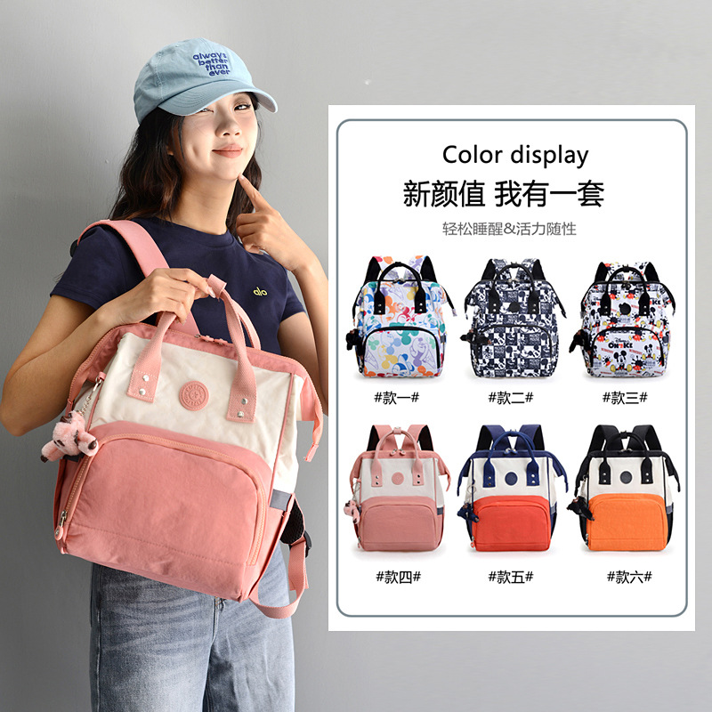 2025 nueva mochila para mujer casual kp momia bolso tela de nailon moda compras mochila con colgante de mono