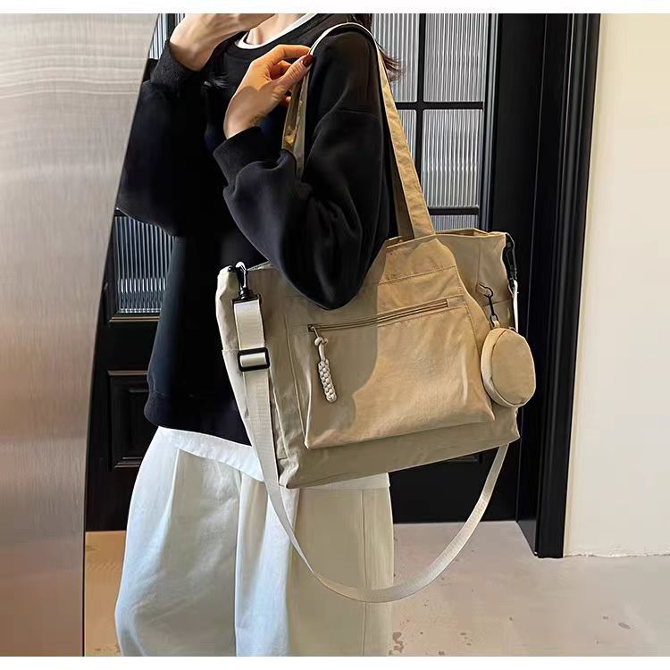 Transfronterizos casuales de color sólido nylon bolso de mano nueva bolsa de tela de transporte de gran capacidad simple y ligera mochila de hombro