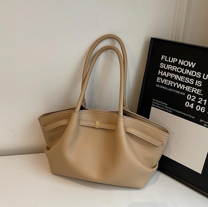 Nicho de diseño de bolsas de cubo de mano para mujeres 2025 nuevo estilo de moda de hombro bolsas de viaje de estilo retro bolsas de brazo